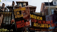 Activists protest outside the Ugandan Embassy over Uganda's parliamentary Anti-Homosexuality Bill