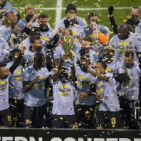 Jonathan Mensah and his Columbus Crew teammates celebrate league win