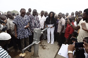 Yvonne Okoro pumping the commissioned bore hole