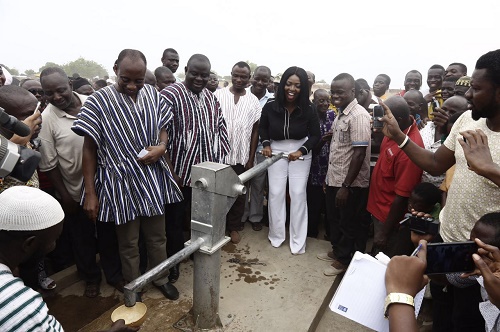 Yvonne Okoro pumping the commissioned bore hole