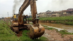 Excavator packed near dam. File photo.