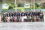 The newly elected officials (in black suit) together with other dignitaries of the commission