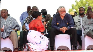 Anita Desoso on her knees as she begs Jerry John Rawlings at the June 4 rally