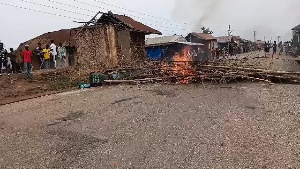 File photo of a burnt house after chaos erupted