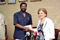 Alfred Okoe Vanderpuye, receiving the cheque from Ms. Nesrin Bayazit, Ambassador of Turkey to Ghana.