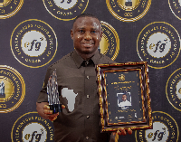 Dr Prince Nelson Mortoti with his award