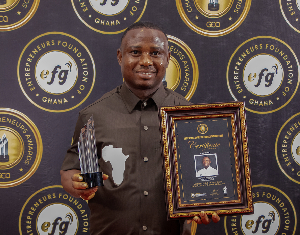 Dr Prince Nelson Mortoti with his award