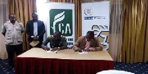 LCA signing over camp tent to Forest Commission