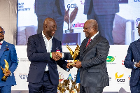 Moses Kwasi Baiden Jnr., CEO and Founder of Margins ID Group receiving the award