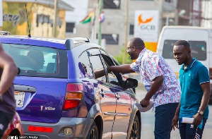 National Organiser of the governing New Patriotic Party Sammi Awuku talking to a driver