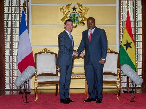 French Prime Minister, Manuel Carlos Valls Galfetti in a handshake with President Mahama
