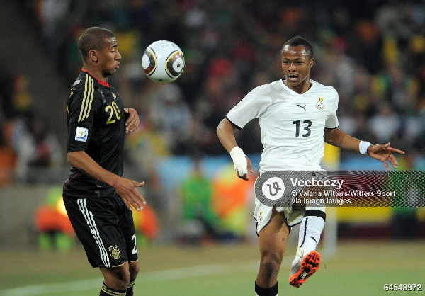 Boateng (L) and Andre Ayew (R) during the game