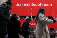 A Johnson & Johnson banner is displayed on the front of the New York Stock Exchange (NYSE)