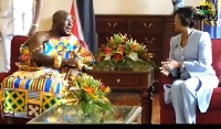 Otumfuo Osei Tutu II (left) having a dicussion with President Christine Carla Kangaloo