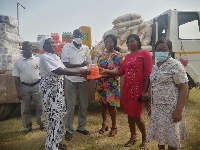 The CEO presenting the items to the beneficiaries