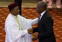 Vice President Amissah-Arthur in a handshake with President Mahamadou Issoufou of Niger