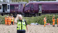 Network Rail and police remain at the crash site