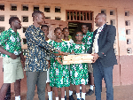 Engineer Eric T. Ayertey (L) presented laptops to the Mt. Mary Demonstration JHS during his visit.