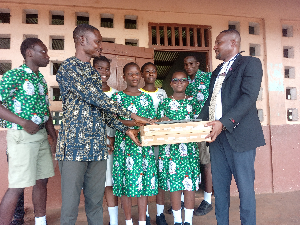 Engineer Eric T. Ayertey (L) presented laptops to the Mt. Mary Demonstration JHS during his visit.