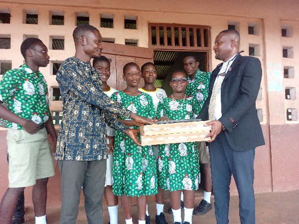 Engineer Eric T. Ayertey (L) presented laptops to the Mt. Mary Demonstration JHS during his visit.