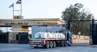 An aid lorry passes by the Rafah crossing during a trial reopening on Sunday