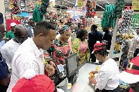 Mrs Samira Bawumia paying for an item at the counter at the new mall