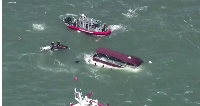 One person has died and three others are missing after a pontoon boat capsized