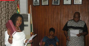 The Greater Accra minister swearing in the MCE