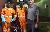 Neil Woodcock with some staff of MODEC at the training centre