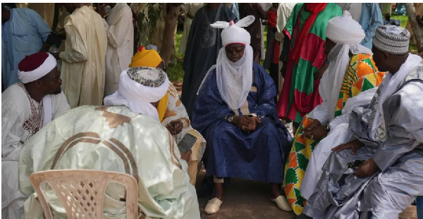 Mourners, including traditional leaders were waiting for the body to be brought to Buhari's home