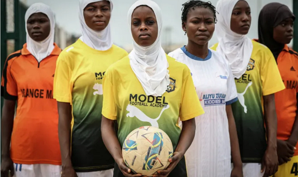 Team members at the Model Queens Football Academy