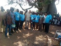 Some UNICEF officials in a group photo with some of the beneficiaries