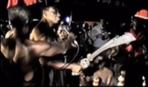 The late Mamponghene, Daasebre Osei Bonsu II (with the sword) pledging his allegiance to Asantehene