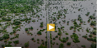 Flood waters cover the Chibuto-Chaimite road in Gaza province, Mozambique, Saturday, Jan. 17, 2026