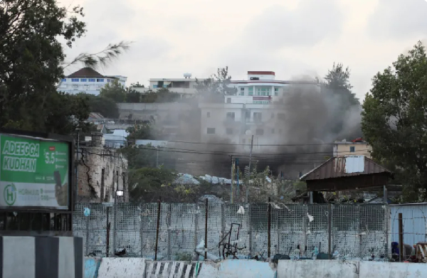 Smoke billows from a compound near the presidential palace, following explosions in Mogadishu