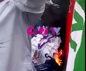 ‘Disappointed’ NDC serial caller burns party flag