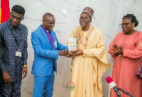 Alban Bagbin (second from the left) bing presented with the Defender of Faith award