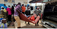 A man is carried from an ambulance as he arrives at a hospital following confirmation of an Ebola