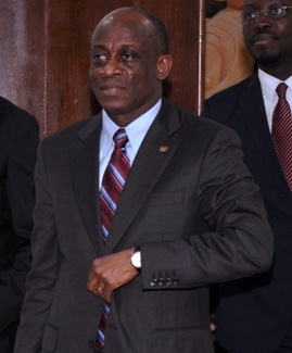 Finance Minister Seth Terkper walking briskly to deliver the 2015 Budget in Parliament