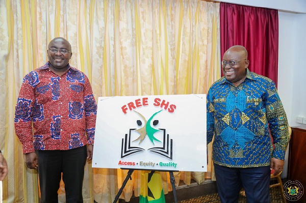 Nana Addo Dankwa Akufo-Addo (r) and Dr Mahamudu Bawumia showcasing a signage of  Free SHS programme