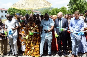 Deputy Minister for Trade and Industry Mr. Carlos Ahenkorah cutting the sod for the science lab
