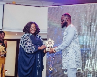 Roselyn Ngissah receiving her award