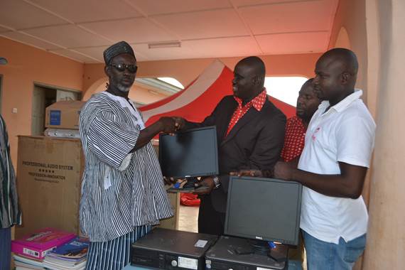 Kwame Osafo Amoah, Airtel Ghana makes the presentation to Nab Akanfella Akanjenya, Chief of Kanjarga