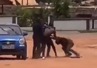 The man engaging in a scuffle with the policemen