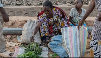People buy and sell as residents return to their homes in Uvira, DR Congo, Dec 13, 2025