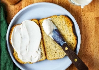 File photo of a slice of bread spread with mayonnaise