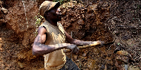 Miner digs for cassiterite at Nyabibwe mine in eastern Congo