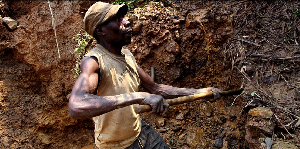 Miner digs for cassiterite at Nyabibwe mine in eastern Congo