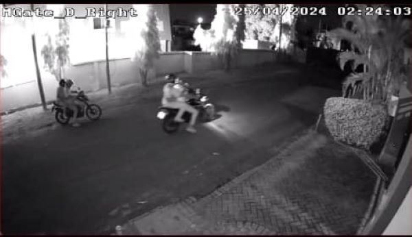 A CCTV image of the four arsonists making their getaway on two motorbikes
