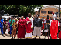Members of the St Francis Catholic Church take part in a way of the Cross re-enactment